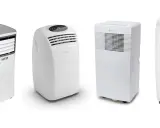 Cuatro aires acondicionados portátiles blancos. El tubo del aire acondicionado portátil sirve para evacuar el aire caliente al exterior.